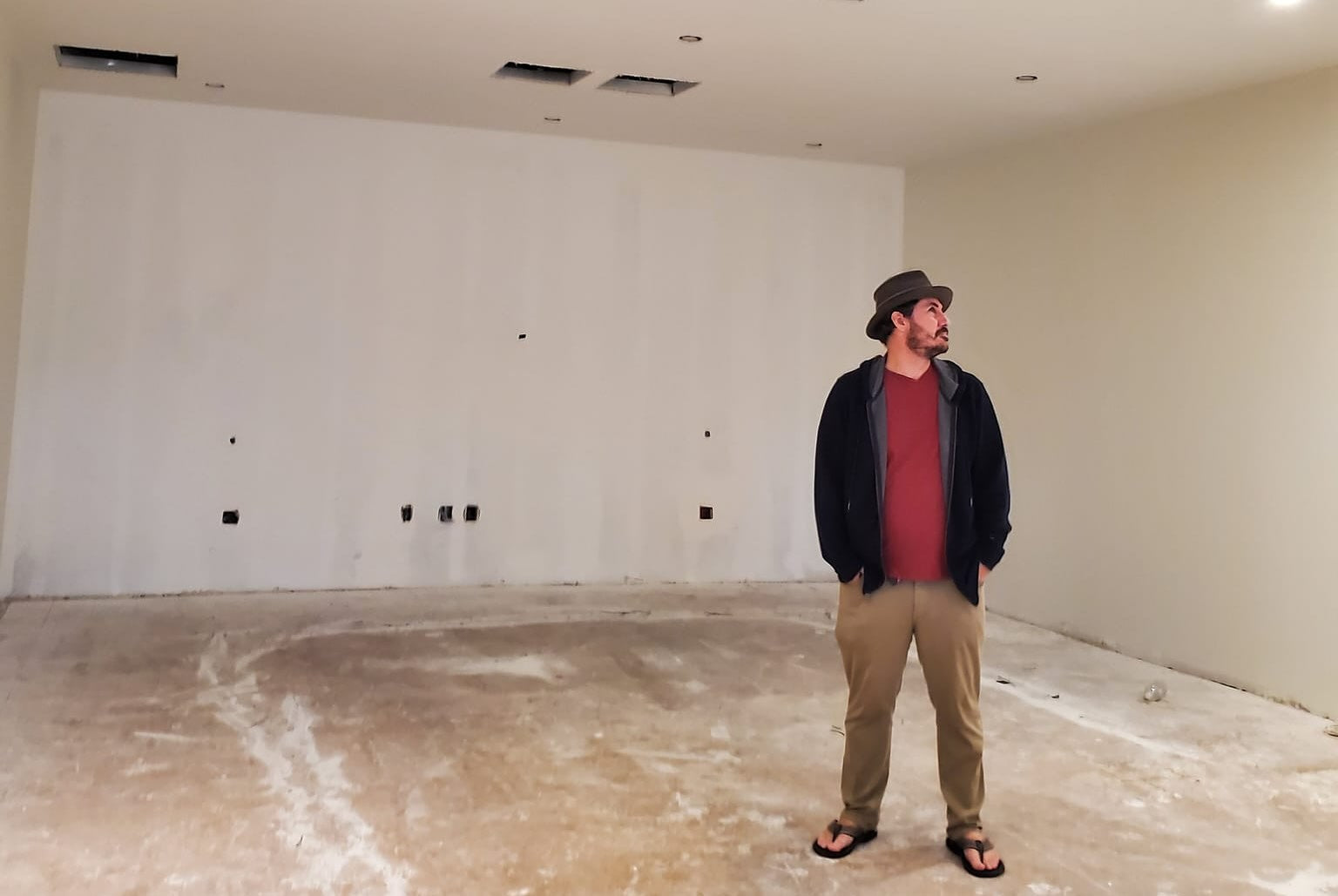 Joe Parvey inspects construction at the new home of House of Stereo in 2022