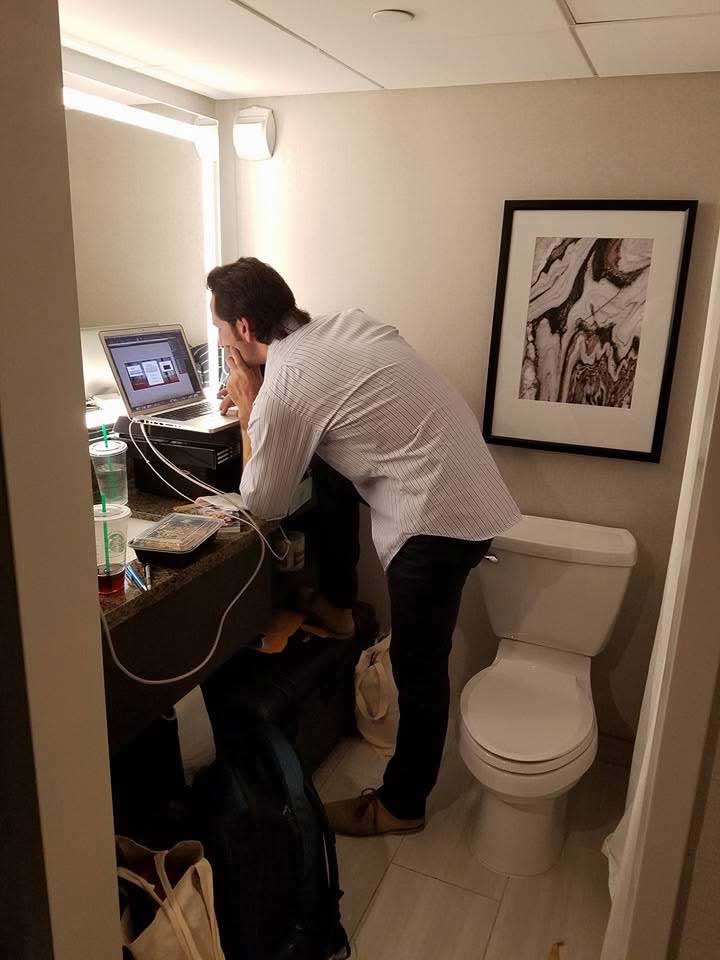David Parvey of Wolf Audio Systems edits the Wolf Audio website in the bathroom during the NY Audio Show 2016